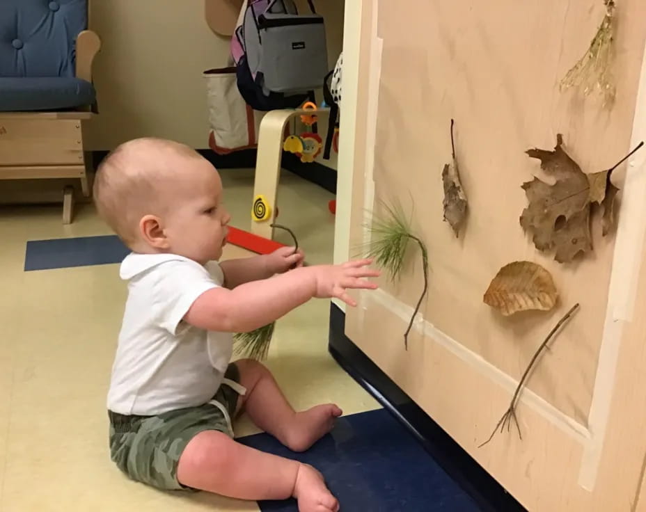 a baby playing with a toy