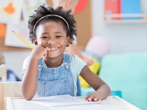 a young girl smiling