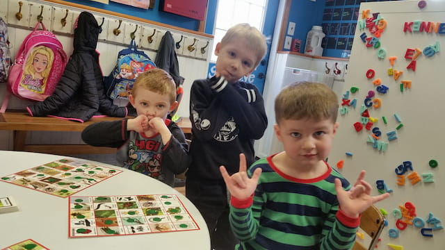 a group of children posing for the camera