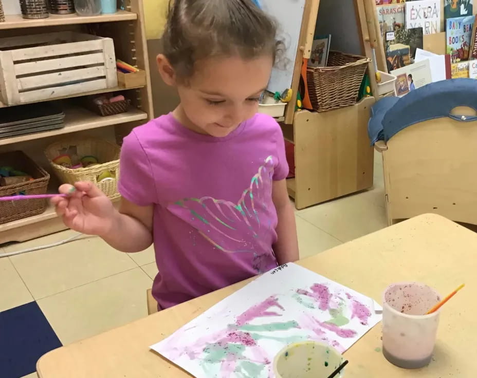 a young girl painting