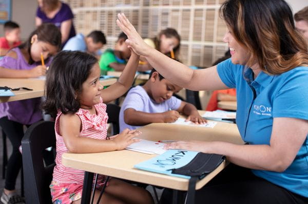 a teacher teaching her students