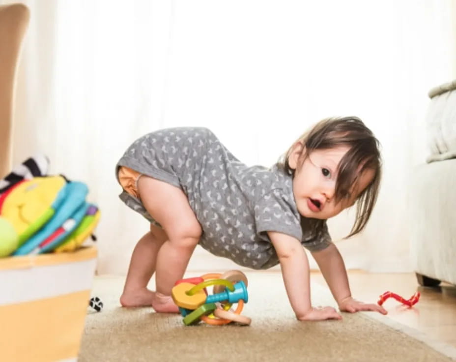 a baby crawling on the floor