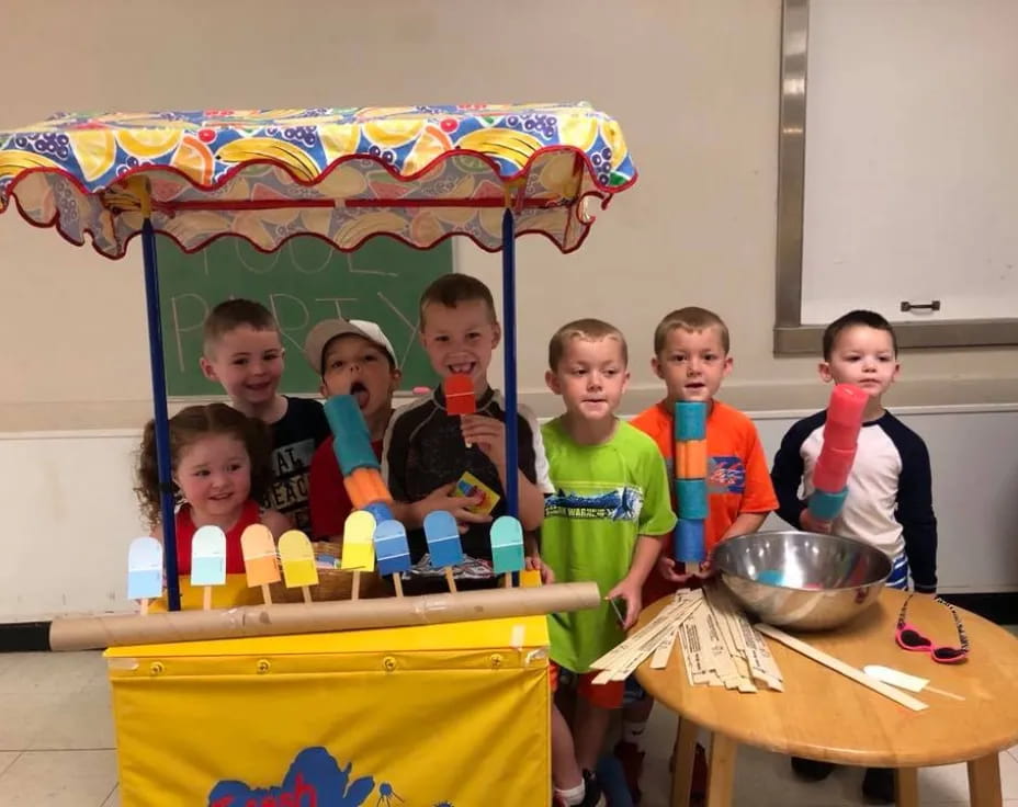 a group of kids in a room