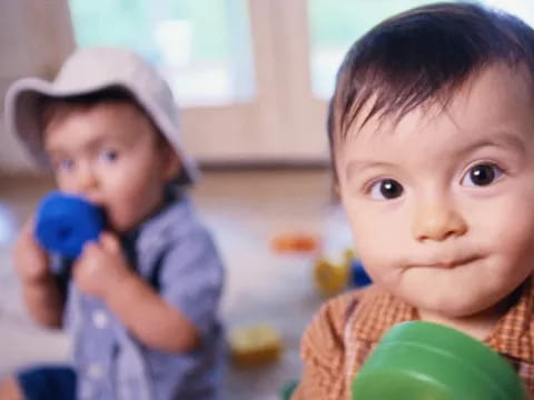 a couple of children holding toys