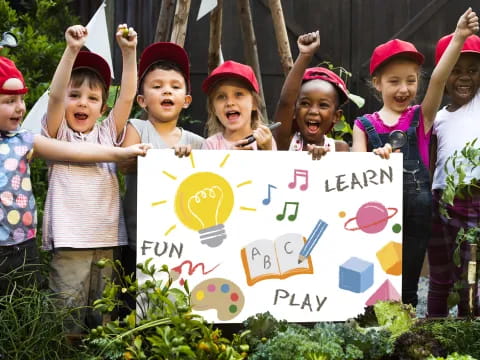 a group of children holding a sign