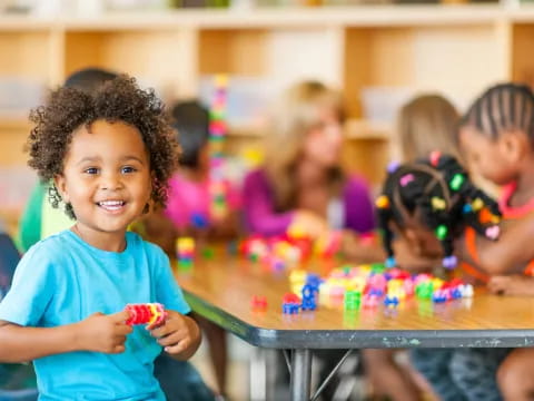 a young girl playing with toys