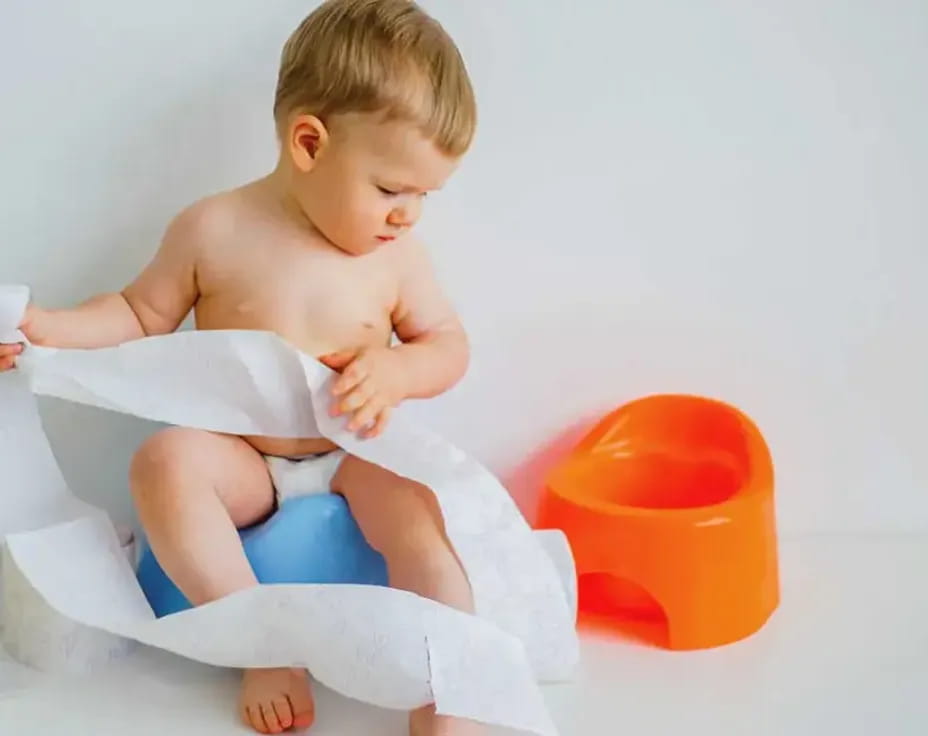 a baby sitting on a chair