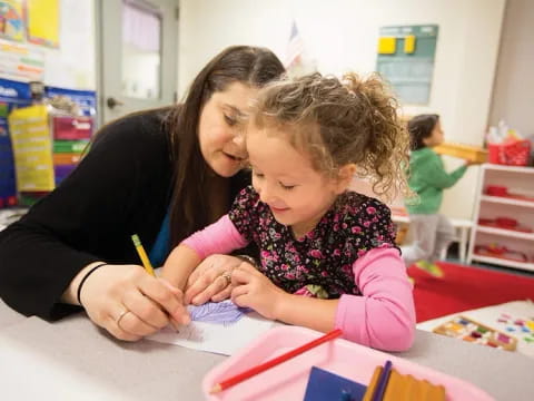 a person and a child coloring