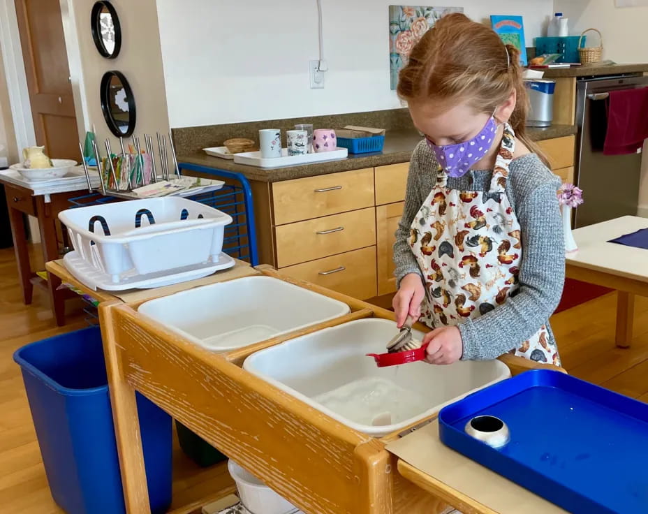 a girl painting a table