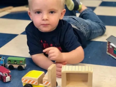 a boy playing with toys