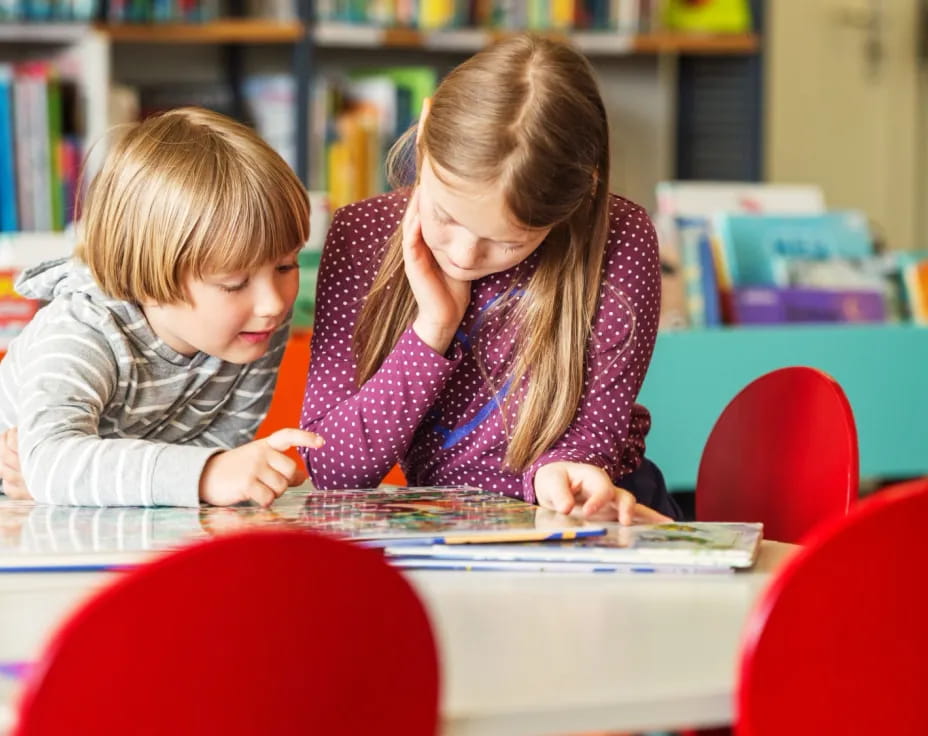 a boy and girl studying