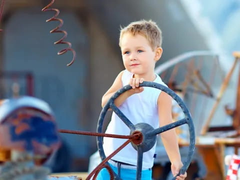 a boy in a blue dress