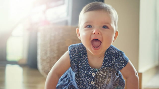 a baby with a surprised expression
