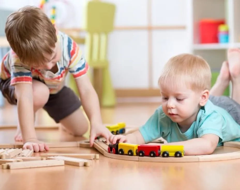a couple of kids playing with toys