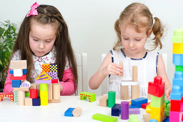 medium shot of kids playing with toys