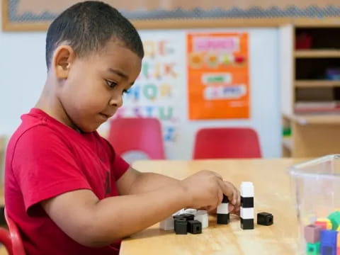a boy playing with toys