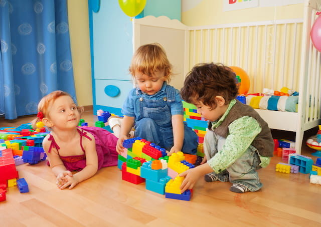 a group of children playing with toys