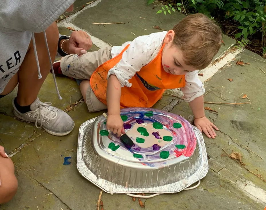 a child playing with a cake