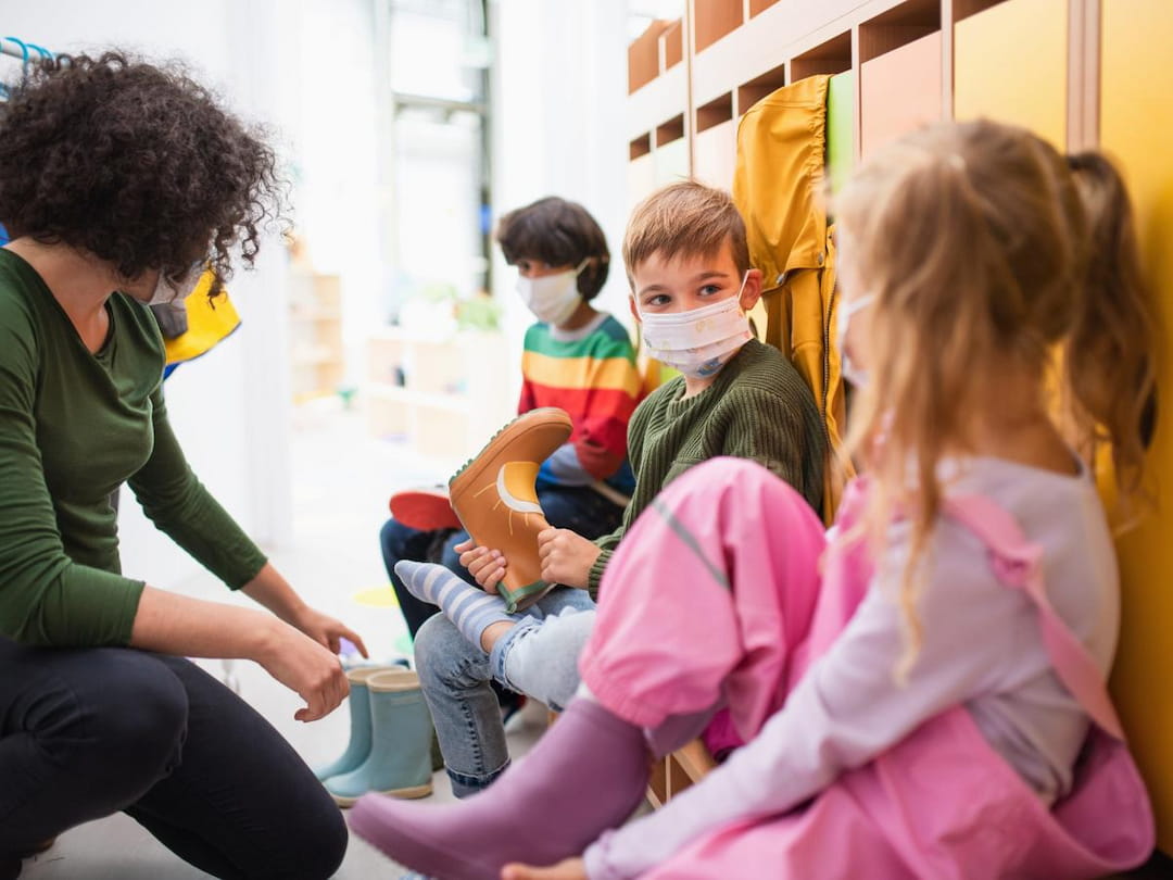a group of children wearing face masks