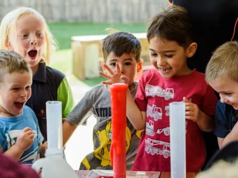 a group of kids playing with a toy
