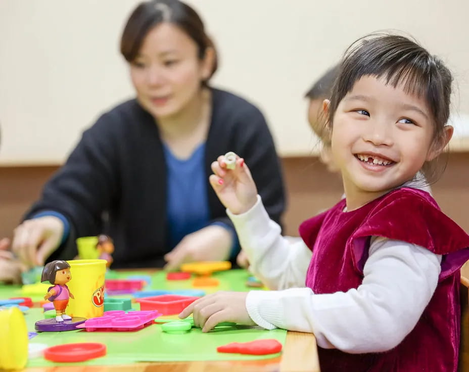 a person and a child painting