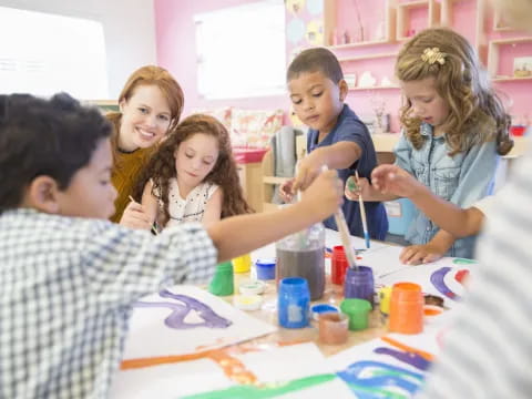 a group of children painting