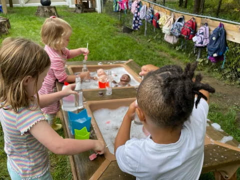 a group of children painting