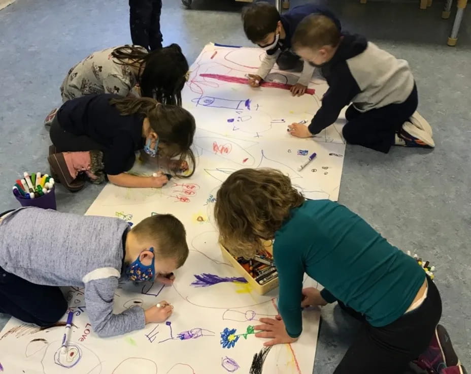 a group of people doing crafts