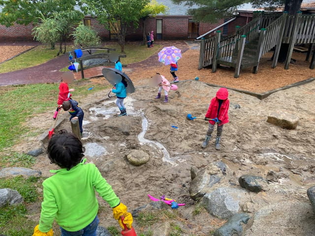 a group of kids playing in a yard