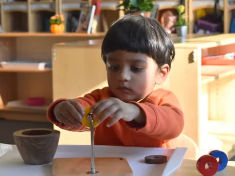 a child sitting at a table
