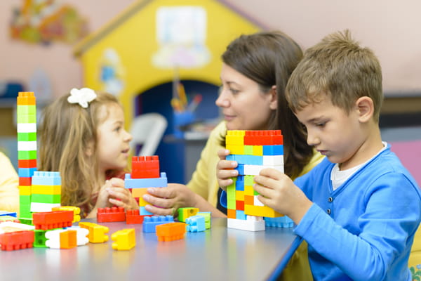 a few children playing with blocks