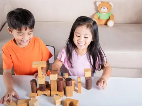 a boy and girl playing chess