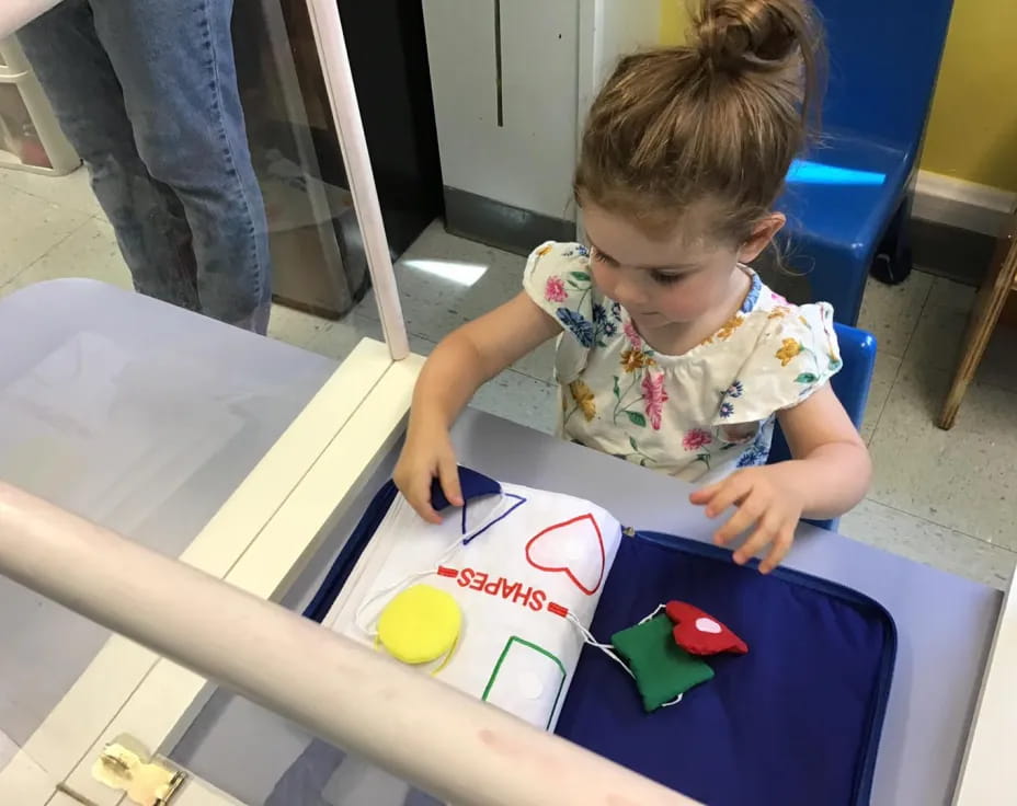 a child coloring on a book