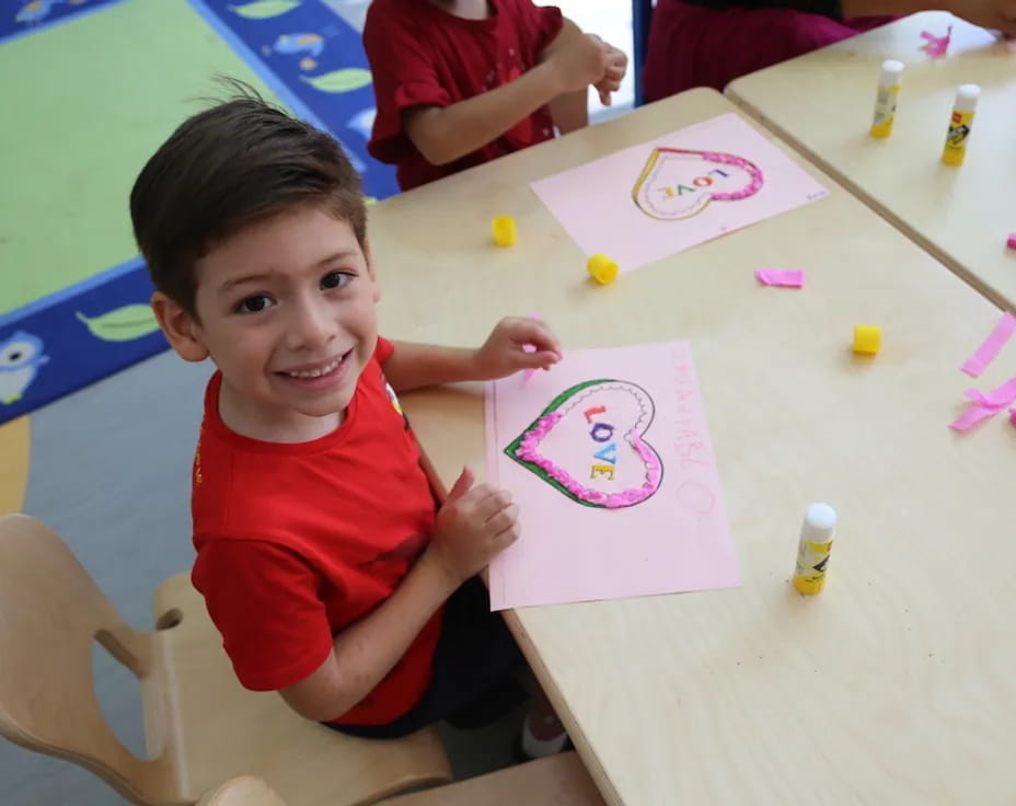 a boy sitting at a table