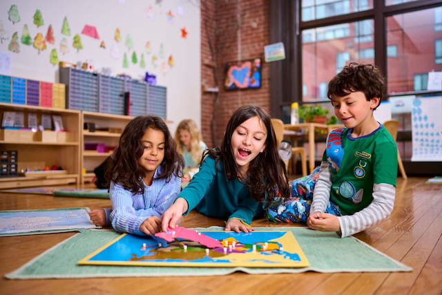 a group of children sitting on the floor