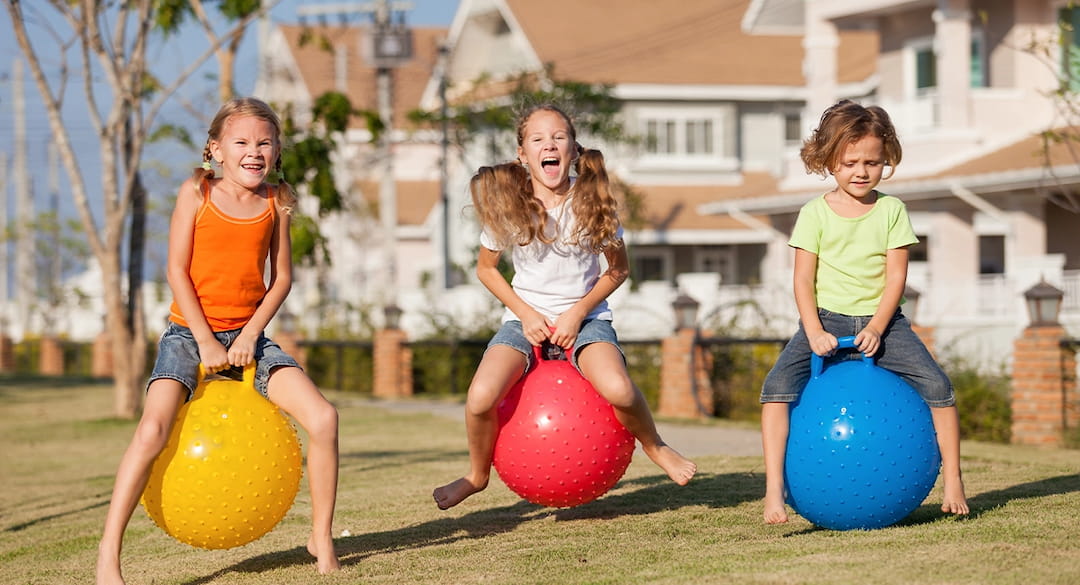 a group of girls playing with balls