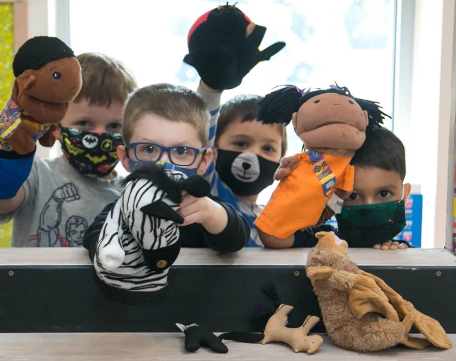 a group of kids wearing clothing