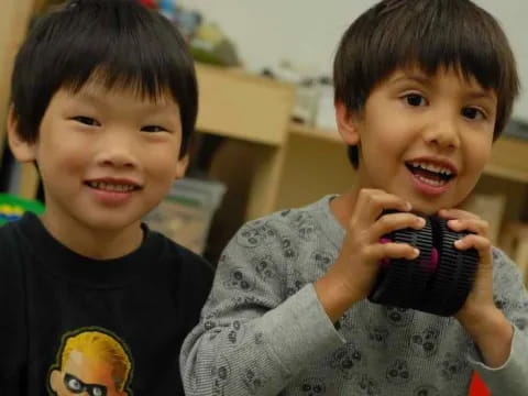 a couple of kids smiling