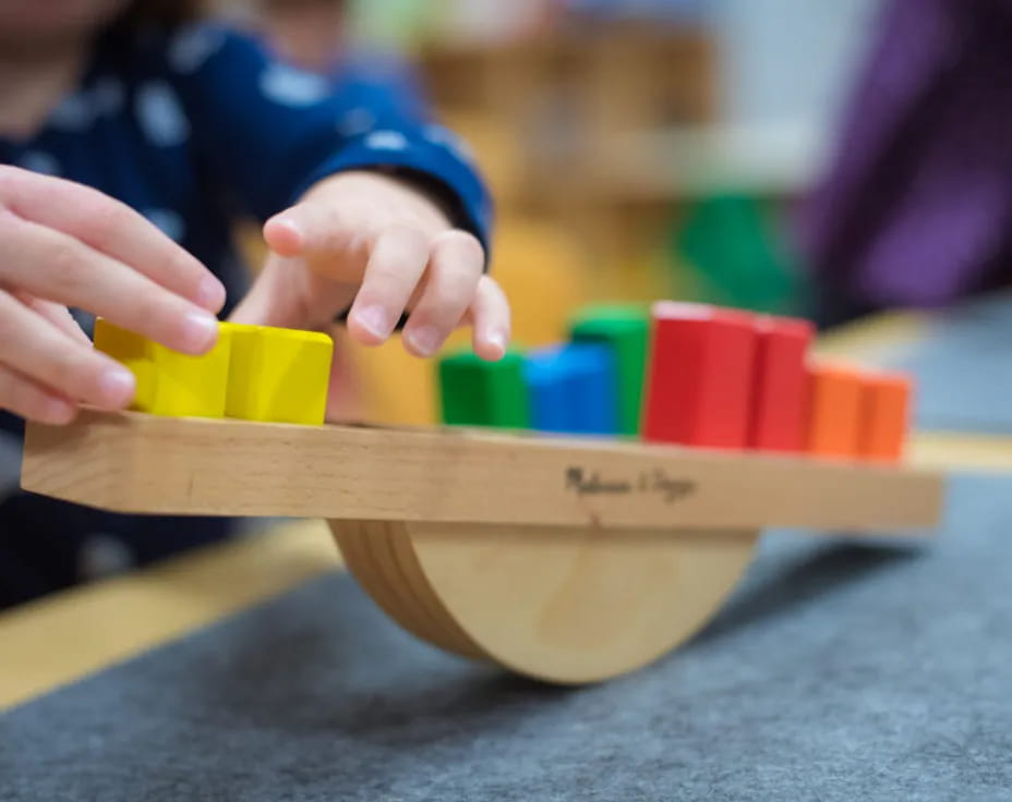 a person building a building blocks
