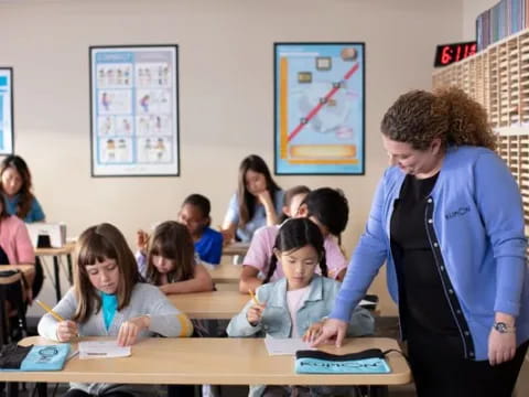 a teacher teaching her students