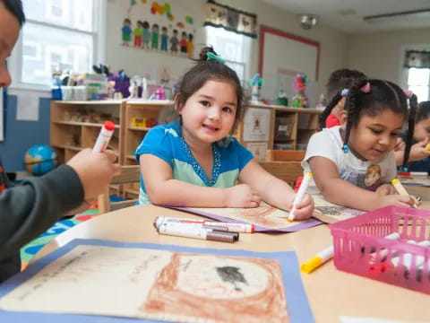 a group of children painting