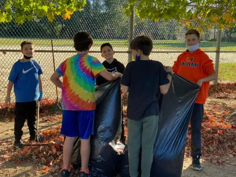 a group of boys holding a flag