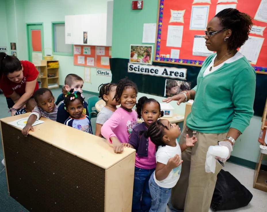 a person and a group of children