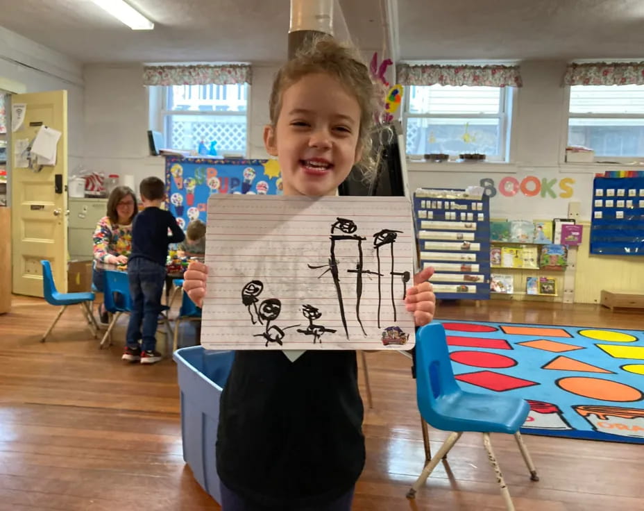 a boy holding a sign