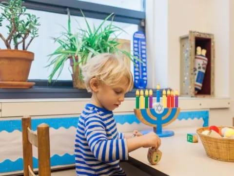 a child holding a toy