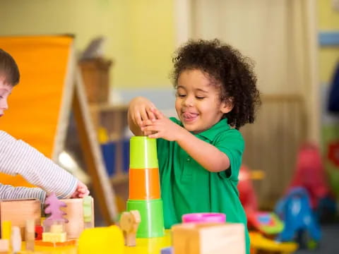 a young girl playing with toys