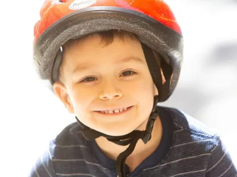 a boy wearing a helmet