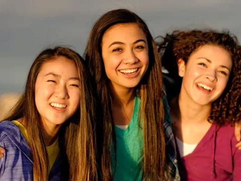 a group of women smiling