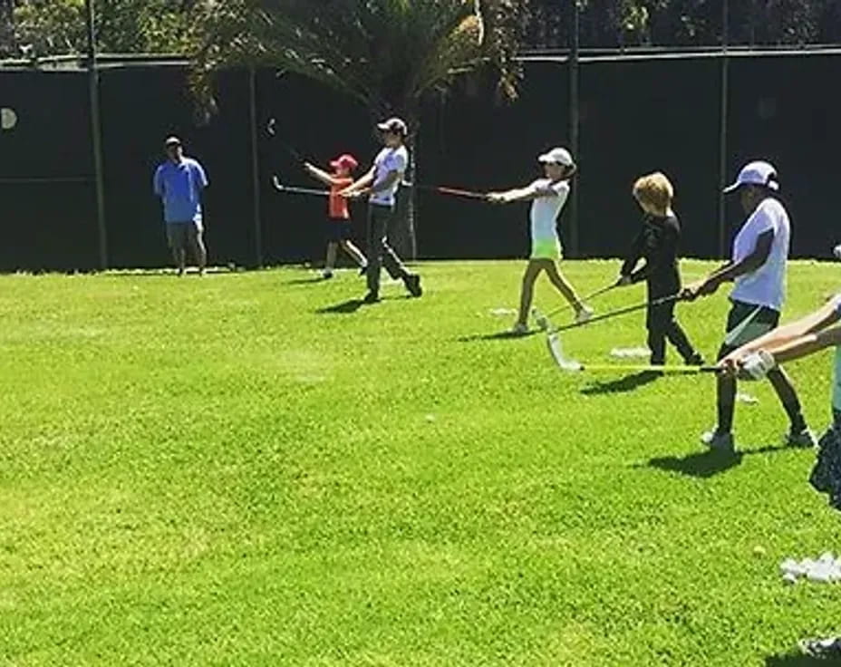 a group of people playing baseball