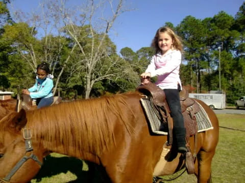 a girl riding a horse